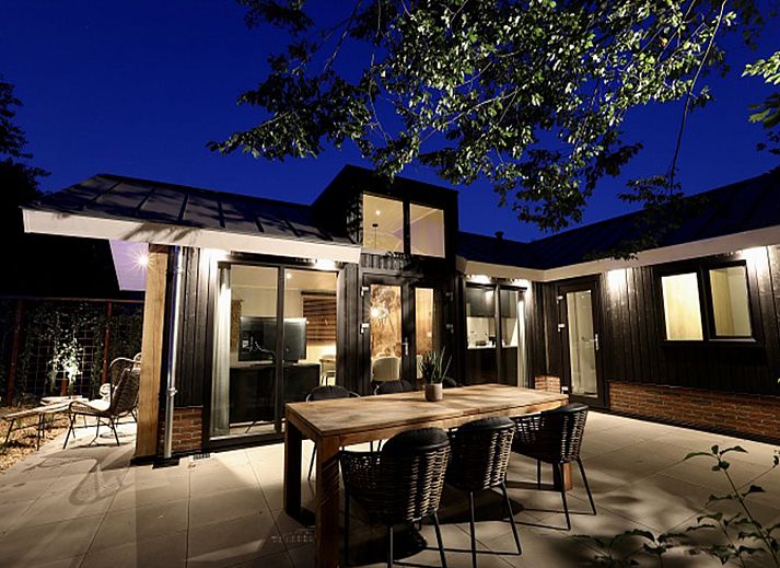 Cozy terrace at Holiday Home De Thijmse Berg, Rhenen, Utrechtse Heuvelrug ideal for family dinners.