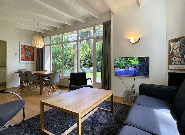 Vacation home in Maarn, Utrecht Hill Ridge, with sunny garden surrounded by wooded area.