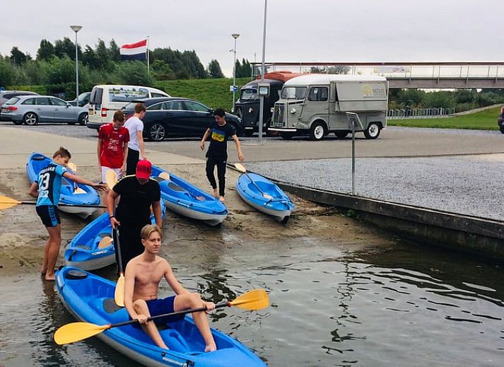 Cozy indoor area of Cottage in IJsselstein, Utrecht. Vacation home with modern kitchen and cozy sitting area for a relaxing stay.