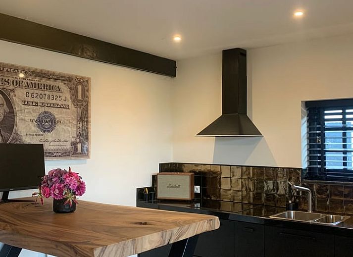 Cozy porch at cottage in Harmelen overlooking green area in Utrecht.