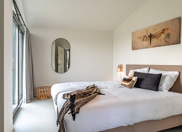 Dining area in Holiday home in Wissenkerke, Noord-Beveland, Zeeland with modern furnishings.