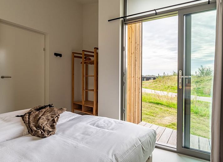 Dining area in Holiday home in Wissenkerke, Noord-Beveland, Zeeland with modern furnishings.