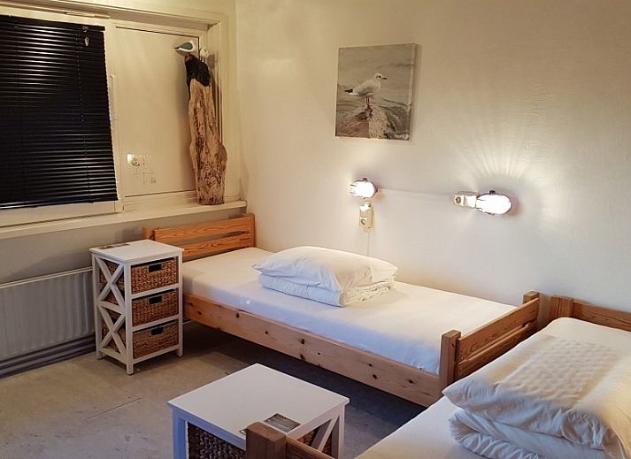 Inn d'n Eenhoorn, een charmant vakantiehuis in Colijnsplaat, Noord-Beveland, Zeeland, met traditionele bakstenen gevel.