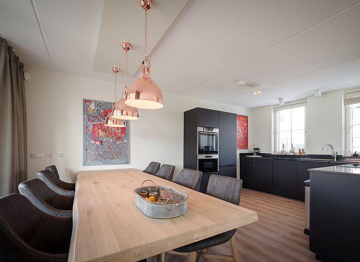 Exterior of Holiday Home Ganuenta in Colijnsplaat, North Beveland with colorful flowers and traditional architecture.