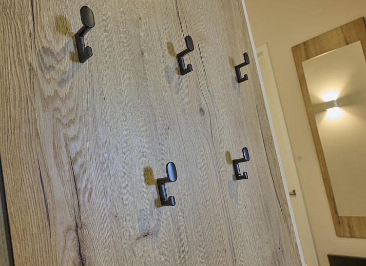 Dining area in Sauna Zee vacation home, Colijnsplaat, North Beveland with modern furnishings.