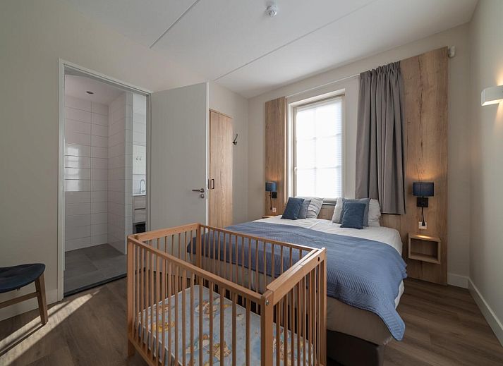 Bright interior space of SeaLuxe Residence vacation home in Colijnsplaat, with comfortable sitting area and dining area.