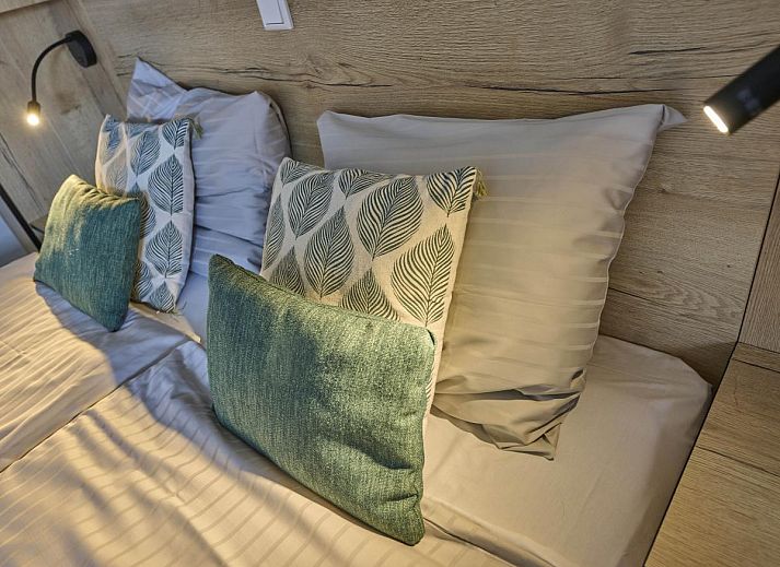 Cozy fireplace in Sauna Zee 27H, a vacation home in Colijnsplaat, North Beveland, Zeeland, offers cozy warmth and atmosphere.