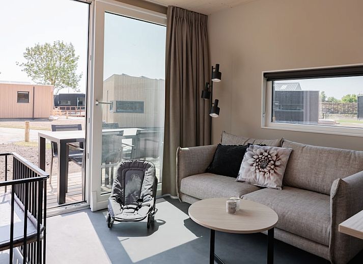 Enjoy a relaxing stay at Baby Lodge 2+1, a modern vacation home in Kamperland, North Beveland, with spacious terrace and green surroundings.