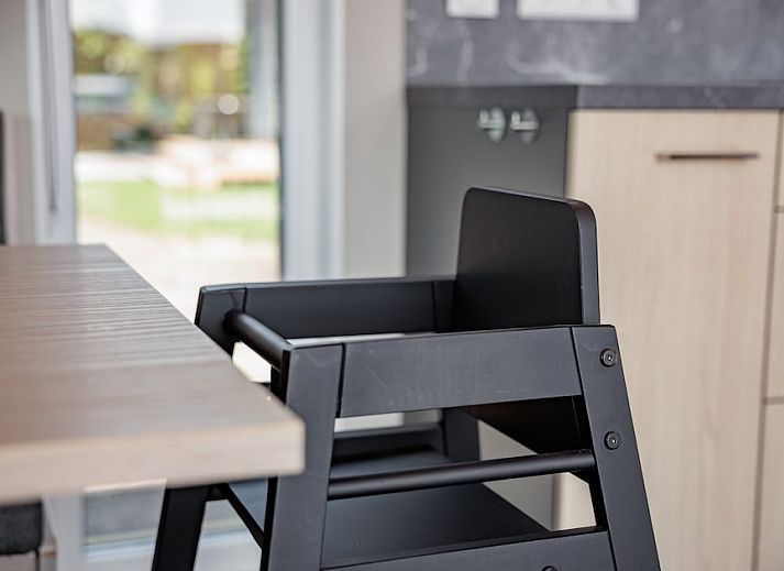 Cozy indoor area of Baby Lodge 2+1 in Kamperland, North Beveland, with comfortable sitting area and terrace view.