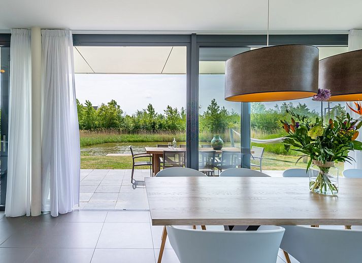 Cozy living room in Duinvallei 38 | De Groote Duynen, Kamperland, with modern fireplace and spacious seating area.