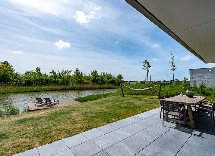 Cozy living room in Duinvallei 38 | De Groote Duynen, Kamperland, with modern fireplace and spacious seating area.