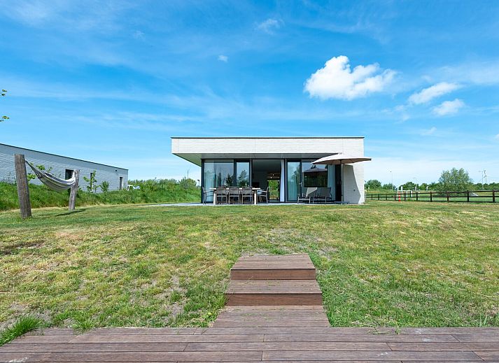 Cozy living room in Duinvallei 38 | De Groote Duynen, Kamperland, with modern fireplace and spacious seating area.