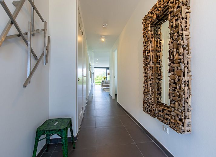 Bright living space in Duinvallei 38 | De Groote Duynen, Kamperland, with large windows and views of nature.