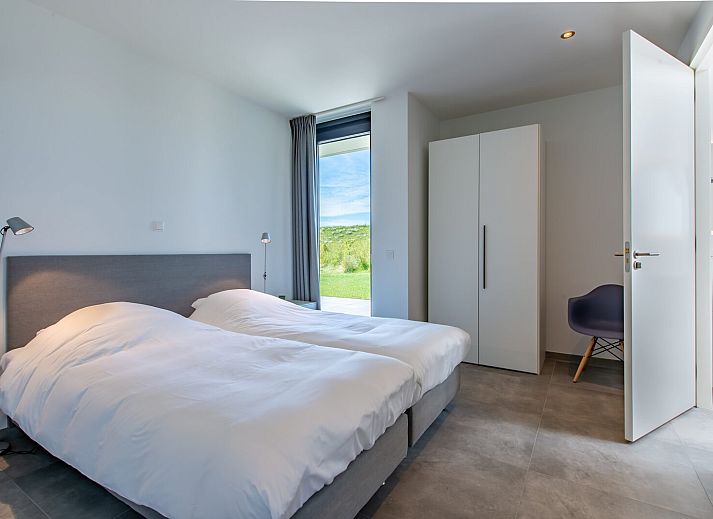 Spacious living room with fireplace in Zandbank 02 | De Groote Duynen, Kamperland, Zeeland.