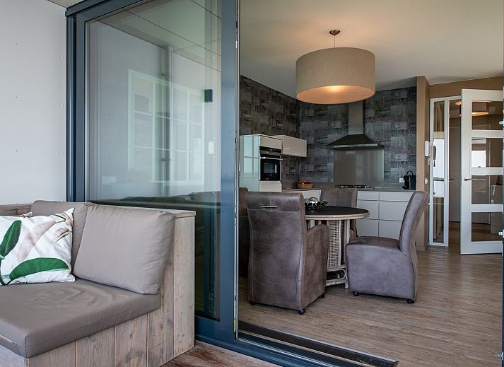 Spacious terrace with comfortable seating at Veerse Muze 7th cottage, Kamperland, overlooking the waters of North Beveland.