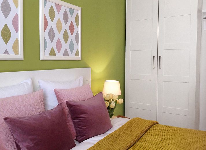 Exterior with stairs and barbecue at Ostrea 16 vacation home, Roompot Beach Resort, Kamperland, Zeeland.