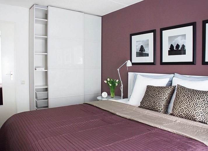 Exterior with stairs and barbecue at Ostrea 16 vacation home, Roompot Beach Resort, Kamperland, Zeeland.