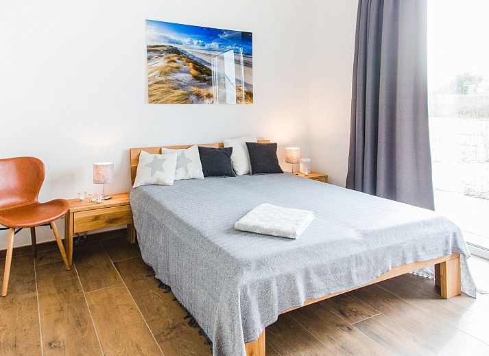 Schotsmanweg 12 | Zeeuws Goedt Ferienhaus in Kamperland, Noord-Beveland, Zeeland mit Blick auf den See von der Terrasse.