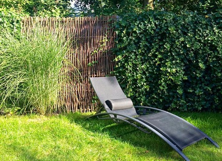 Gezellige woonkamer van Zeeland-Strandhuis vakantiehuis in Kamperland met uitzicht op terras, Noord-Beveland, Zeeland.