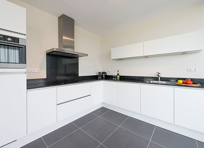 Gemuetliches Wohnzimmer im Ferienhaus Zandbank 18 | De Groote Duynen, Kamperland, mit Kamin.