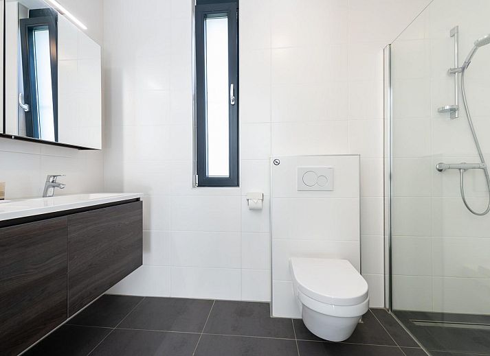 Cozy sitting area with fireplace in Duinvallei 06, vacation home in Kamperland, Noord-Beveland, Zeeland.