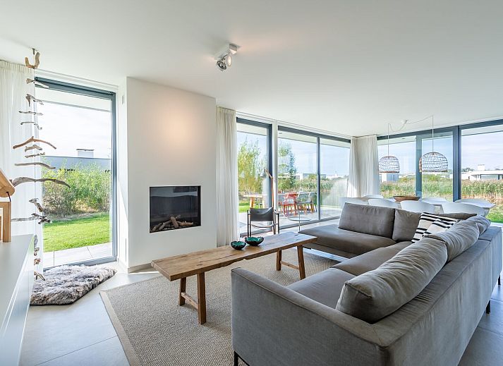 Dining room overlooking nature at Waterline 09, vacation home in Kamperland, Zeeland.