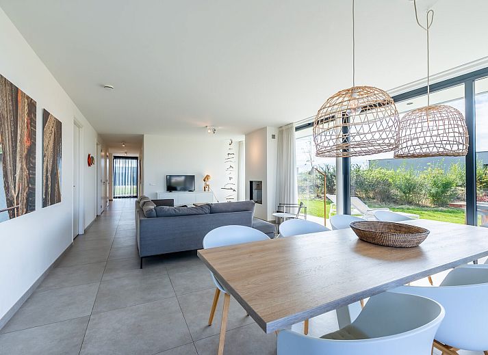 Dining room overlooking nature at Waterline 09, vacation home in Kamperland, Zeeland.