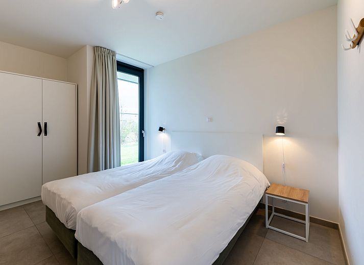 Cozy sitting area with fireplace in Waterline 09, vacation home in Kamperland, Zeeland.