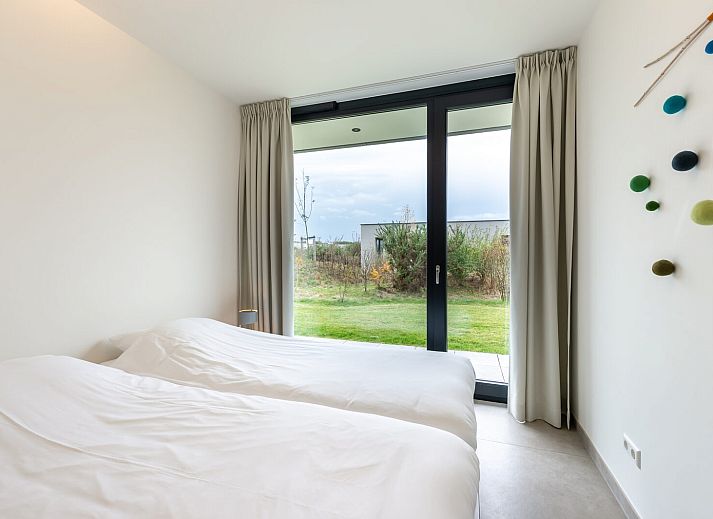Cozy sitting area with fireplace in Waterline 09, vacation home in Kamperland, Zeeland.