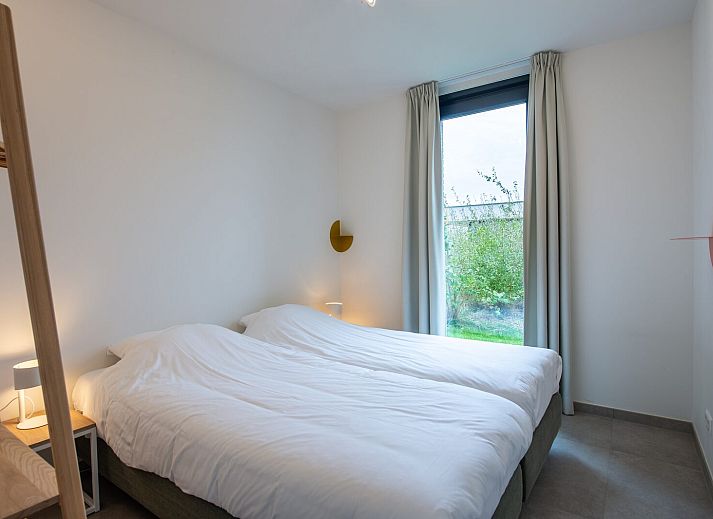 Modern living room with comfortable sofa in Waterline 09, bungalow in Kamperland, North Beveland.