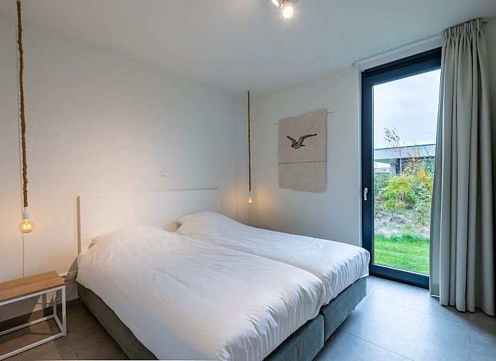 Modern living room with comfortable sofa in Waterline 09, bungalow in Kamperland, North Beveland.