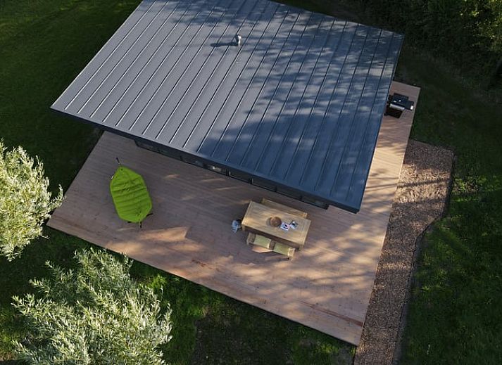 Modern vacation home in Kamperland with spacious veranda surrounded by nature, perfect for relaxation in North Beveland, Zeeland.