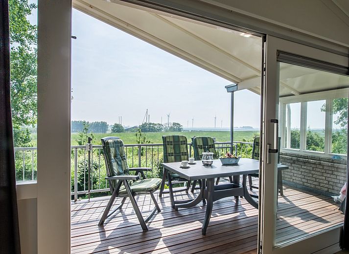 Cozy living room in Ostrea 34, Roompot Beach Resort, Kamperland, vacation home with comfortable seating area.