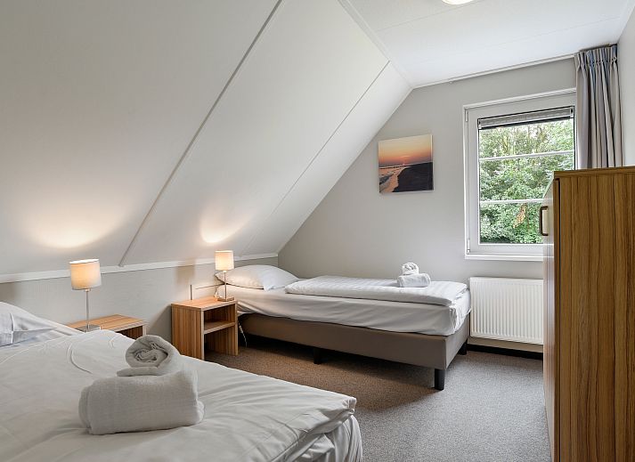 Gezellige zithoek in de 6-persoons bungalow van Resort Haamstede in Schouwen-Duiveland, Zeeland.