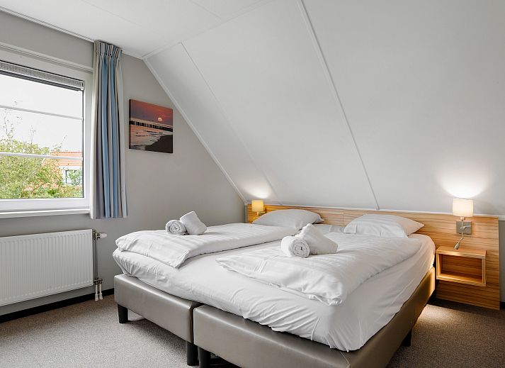 Gezellige zithoek in de 6-persoons bungalow van Resort Haamstede in Schouwen-Duiveland, Zeeland.