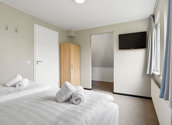 Gezellige zithoek in de 6-persoons bungalow van Resort Haamstede in Schouwen-Duiveland, Zeeland.