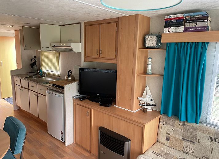 Cozy terrace with parasol at VZ996 Mobile home in Burgh Haamstede, Burgh-Haamstede, Schouwen-Duiveland, Zeeland.