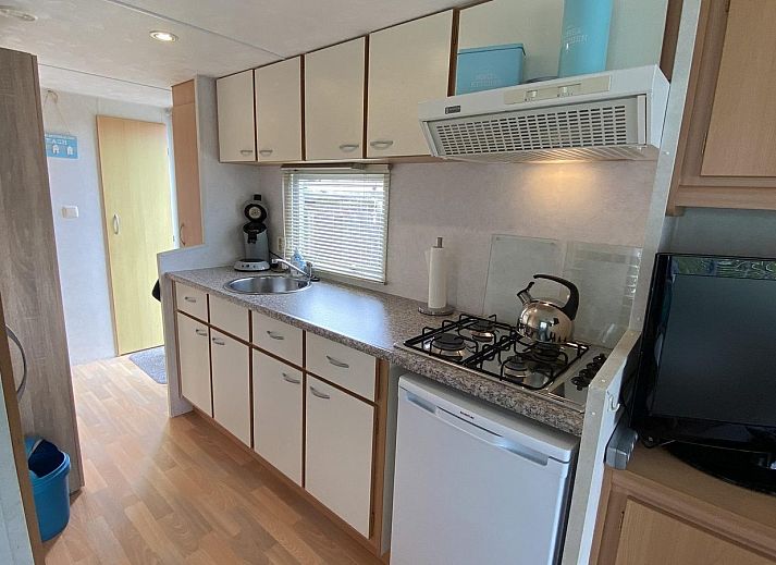 Cozy terrace with parasol at VZ996 Mobile home in Burgh Haamstede, Burgh-Haamstede, Schouwen-Duiveland, Zeeland.