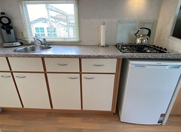 Cozy terrace with parasol at VZ996 Mobile home in Burgh Haamstede, Burgh-Haamstede, Schouwen-Duiveland, Zeeland.