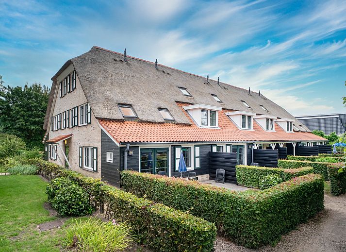 Spacious living room in Residence 't Hof van Haamstede, 6-person farm house in Burgh-Haamstede, Zeeland.