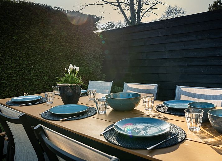 Enjoy a sunny terrace at Vakantiewoning Schouwse Duin 27 "l'Ancora" in Burgh-Haamstede, perfect for outdoor dining.