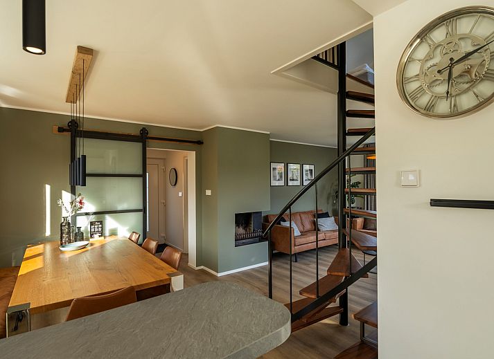 Stylish garden set on the terrace of Holiday home Schouwse Duin 27 "l'Ancora" in Burgh-Haamstede, surrounded by greenery.