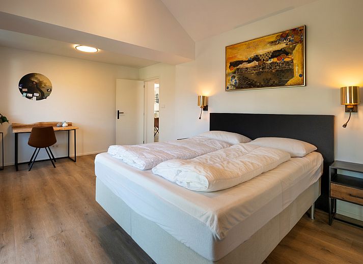 Cozy dining area on the terrace of Holiday home Schouwse Duin 27 "l'Ancora" in Burgh-Haamstede, ideal for family dinners.