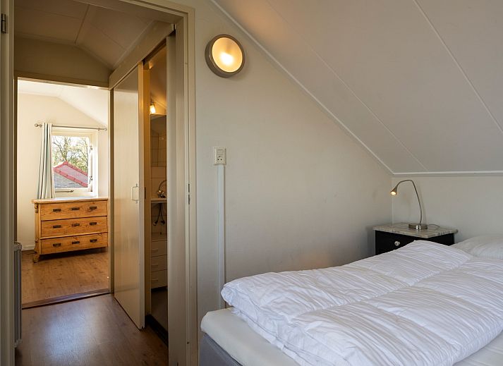 Cozy dining area on the terrace of Holiday home Schouwse Duin 27 "l'Ancora" in Burgh-Haamstede, ideal for family dinners.