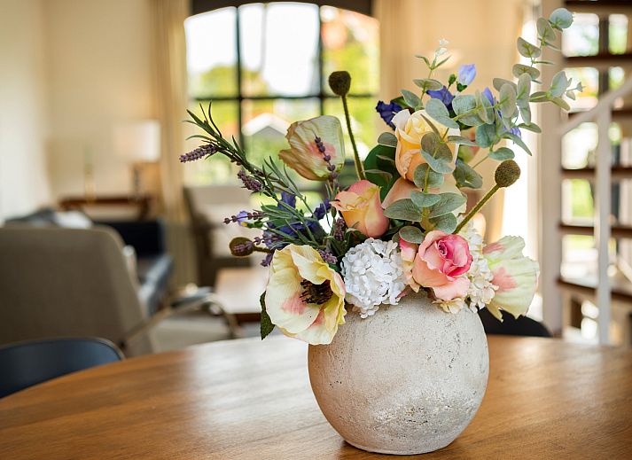 Terrace of Holiday home Schouwse Duin 35 in Burgh-Haamstede with garden table and parasol for summer days in Zeeland.