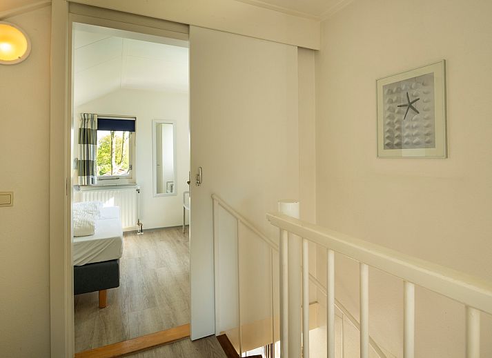 Detail of tableware on the terrace of Holiday home Schouwse Duin 35 in Burgh-Haamstede, ideal for outdoor dining.