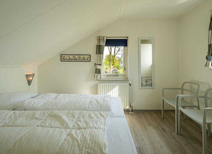 Detail of tableware on the terrace of Holiday home Schouwse Duin 35 in Burgh-Haamstede, ideal for outdoor dining.