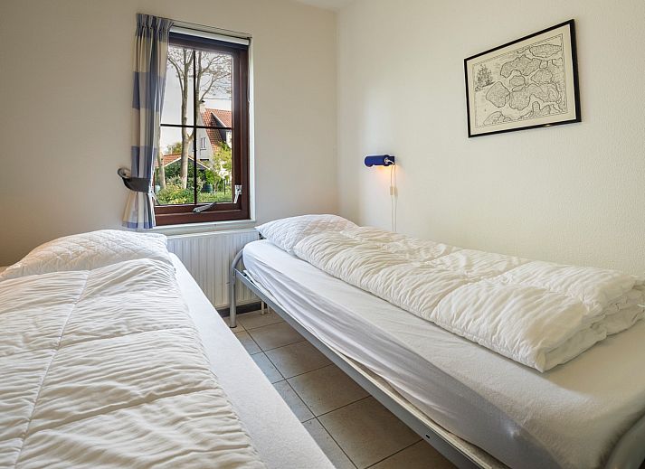 Cozy sitting area in Holiday home Schouwse Duin 35, Burgh-Haamstede, overlooking the garden in Zeeland.