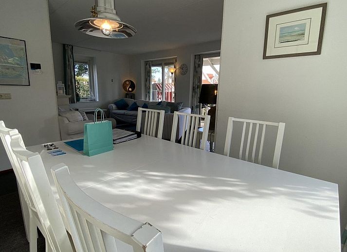 Charming vacation home VZ217 in Bruinisse, Zeeland with spacious driveway and cozy outdoor area.