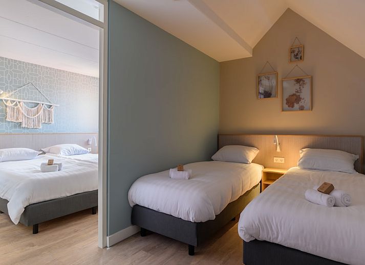 Stylish interior of Apartment Comfort 4AR in Bruinisse, Zeeland, with modern kitchen and cozy sitting area for a relaxing stay.